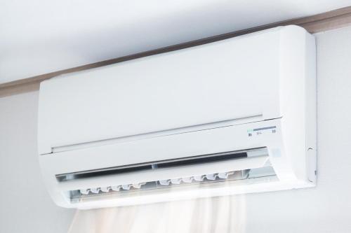 a white refrigerator freezer sitting next to a window at Marina Resort - Pool And Parking LUX - Happy Rentals in Borghetto Santo Spirito