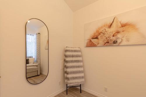 a bathroom with a mirror and a towel at Mountain Escape with Pool, Near Ski Slopes & Trails in Wentworth-Nord