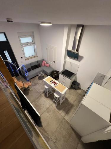 an overhead view of a living room with a couch and a table at To&To Apartments 1 Bedroom in Stuttgart