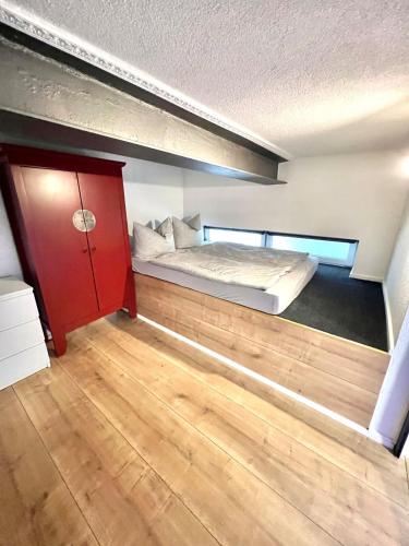 a bedroom with a bunk bed in a loft at To&To Apartments 1 Bedroom in Stuttgart