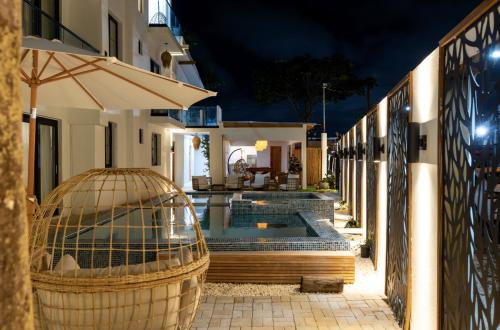 a bird cage sitting next to a house at night at Couples Suites at Ocean Park Beach Club in San Juan