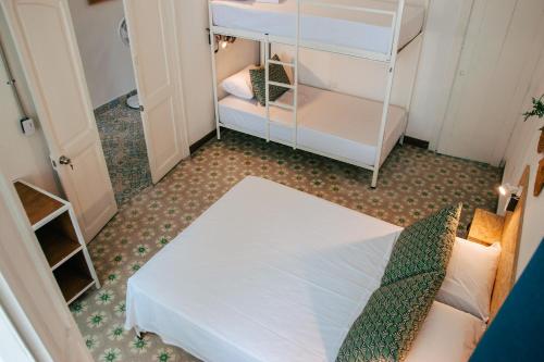 a small room with a bunk bed and a bunk bed at Centro Hostel Medellin in Medellín