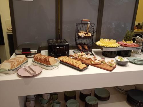 a buffet with different types of food on a table at Hotel Espacio 94 in Bogotá