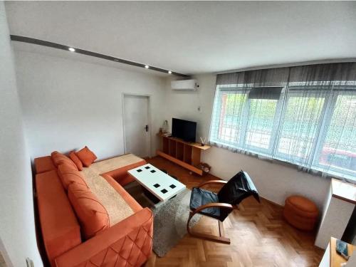 a living room with a couch and a table at Apartman 2M Prijepolje 