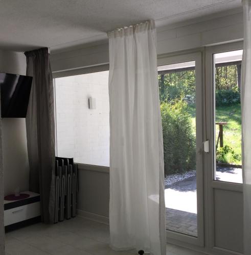 Μια τηλεόραση ή/και κέντρο ψυχαγωγίας στο Holiday Home Dee/Syre am Erlenhofsee