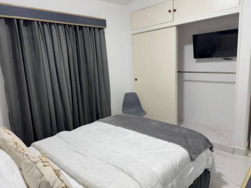 Katil atau katil-katil dalam bilik di Aparto Suites Trigal