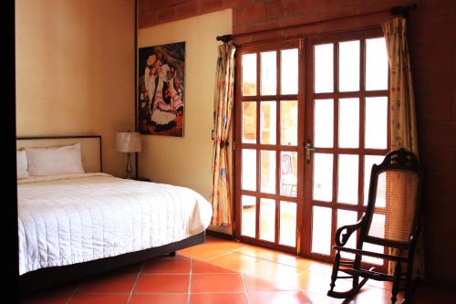 Postel nebo postele na pokoji v ubytování Casa de los Sauces en Atlixco, Puebla