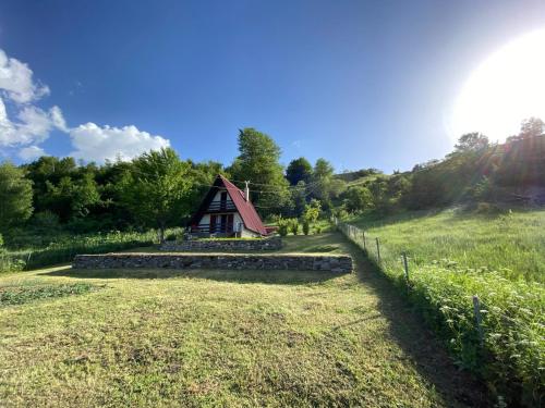 a small cabin in the middle of a field at Hilltop cabin in Podgorica