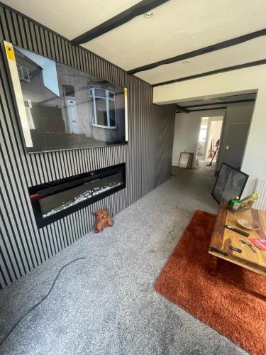 a living room with a fireplace and a tv at Haven Vale in Stockton-on-Tees
