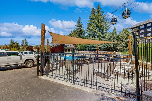 a gate with chairs and a gazebo at Emerald Views at the West in Steamboat Springs