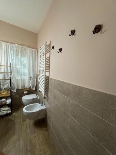 a bathroom with a toilet and a sink in it at PAO Elena Resort in Monterubbiano