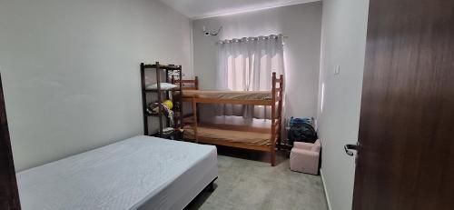 Ένα ή περισσότερα κρεβάτια σε δωμάτιο στο Beach Residencial Prehenn 800 metros da praia