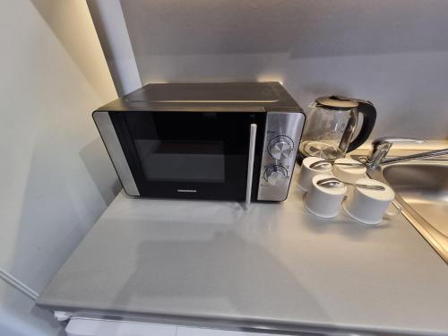 Kuchyň nebo kuchyňský kout v ubytování 2405 Cosy Mountain View Apartment - 200mbps Wi-fi