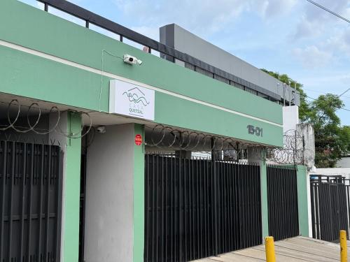 a building with a green and black fence at Casa Quetzal in Guatemala