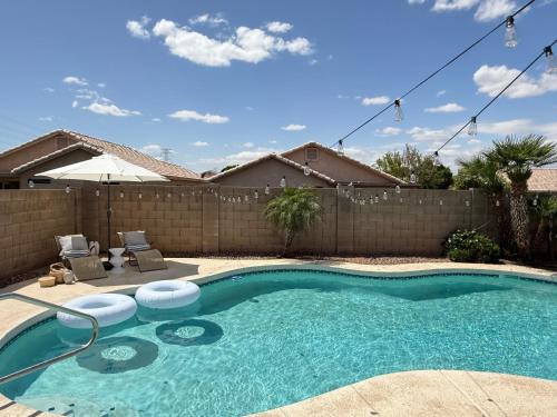 a swimming pool in the backyard of a house at Cactus Bonito in Phoenix
