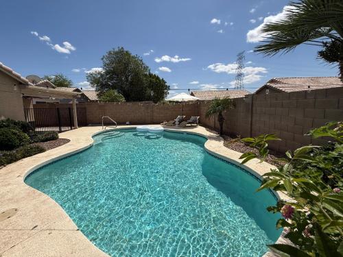 a swimming pool in the backyard of a home at Cactus Bonito in Phoenix
