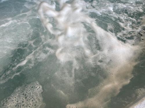 a pile of ice in a body of water at Dolafon Luxury Glamping Pod 2 With Hot Tub in St Asaph