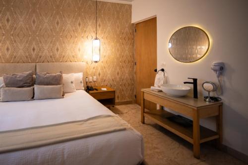 Ένα ή περισσότερα κρεβάτια σε δωμάτιο στο Roma Conesa Hotel Boutique