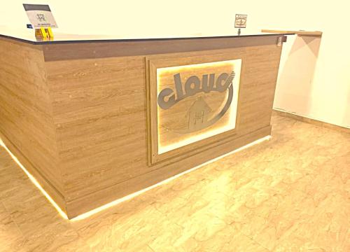 a wooden wall with a sign on top of it at Cloud9h in Medellín