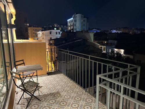 a chair sitting on top of a balcony at night at Taksim Millennium Alkan Residence in Istanbul