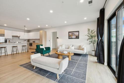 a living room with a couch and a table at Skyline Nights in Downtown Nashville Walk to Broadway with Pool and Gym in Nashville