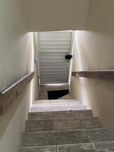 a stairway leading up to a building with a door at Apartamento Boa Vista in Garanhuns