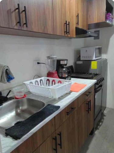 a kitchen with a sink and a counter top at Departamento Atlixco in Atlixco