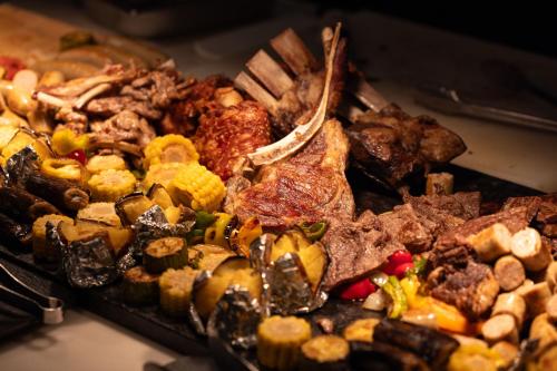a bunch of different types of food on a table at 青岛海天大酒店 山海相拥典雅奢华 in Qingdao