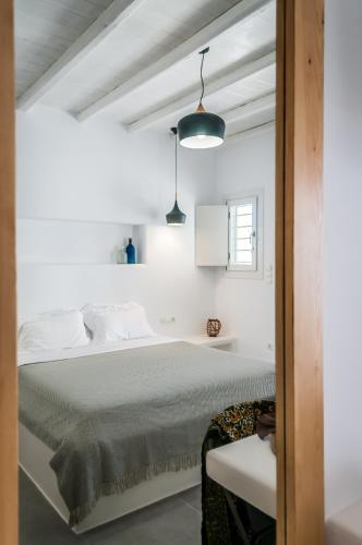 Postel nebo postele na pokoji v ubytování Vilos Suites