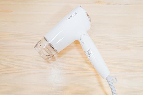 a white electric razor sitting on top of a wooden table at タスキスマート池袋一号館Tasuki Smart Ikebukuro1 in Tokyo