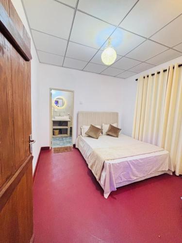 Postel nebo postele na pokoji v ubytování WyDee Villas