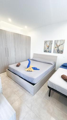 a bedroom with two beds in a room at 100m from Paceville Apartment in St. Julianʼs