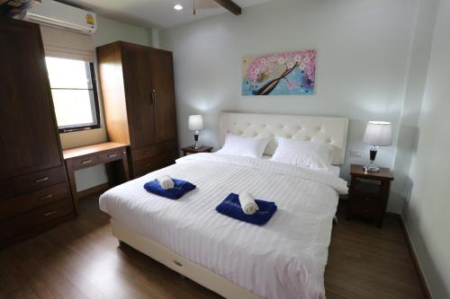 Postel nebo postele na pokoji v ubytování Baan Ping Tara Tropical Private Pool Villa