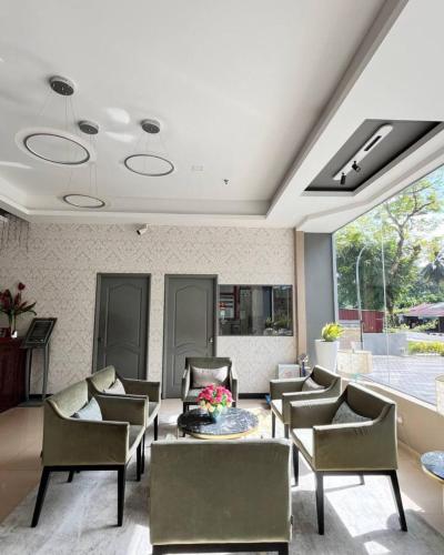 a large living room with a table and chairs at Langkawi Seaview Hotel in Kuah