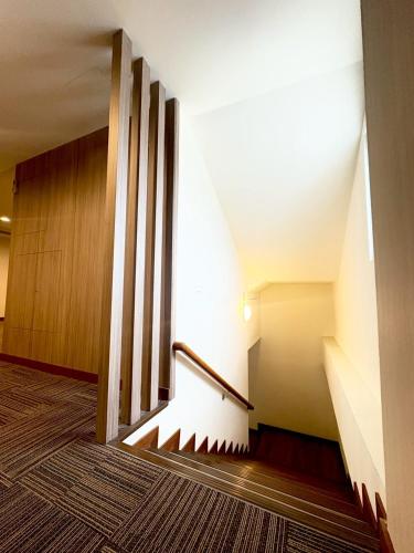 a staircase in a building with a stair case at Tc慢旅花蓮館-近東大門夜市市中心 in Hualien City