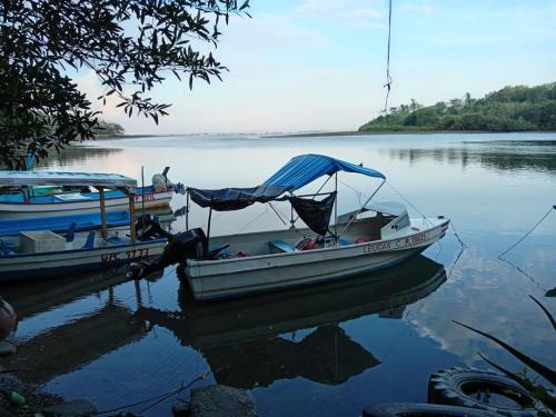 two boats are docked in the water on a lake at Casa Mares in Lepanto