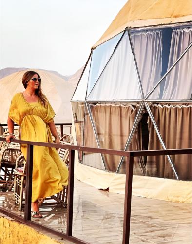 a woman standing in front of a tent at Star Wars luxury camp in Wadi Rum