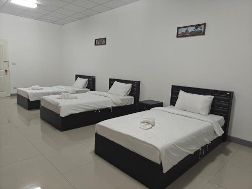 Postel nebo postele na pokoji v ubytování Savan Itecc Hotel