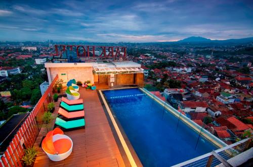 a swimming pool on the roof of a building at PRIME PARK Hotel Bandung in Bandung