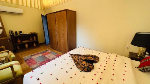 a bedroom with a large bed with a comforter with at Star Wars luxury camp in Wadi Rum