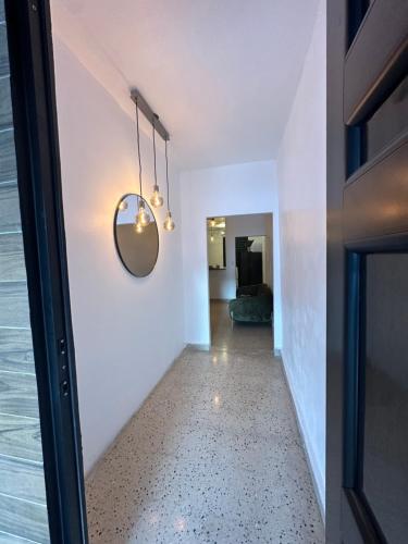 a hallway of a house with a mirror on the wall at Blissful Homes Fajardo in Fajardo