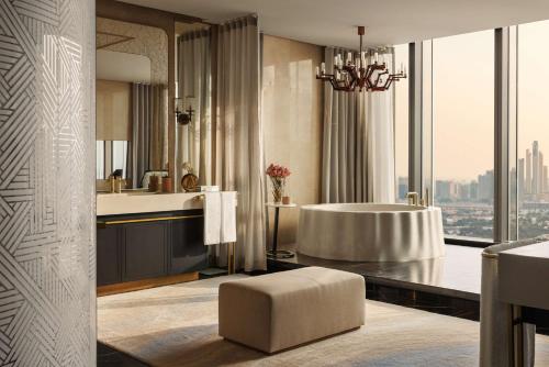 a bathroom with a tub and a large window at One&Only One Za'abeel in Dubai