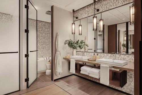 a bathroom with two sinks and a large mirror at One&Only One Za'abeel in Dubai