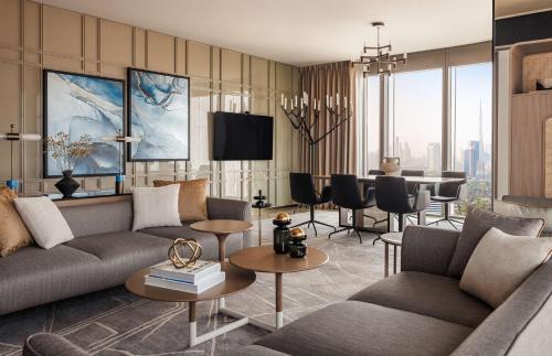a living room with a couch and a table at One&Only One Za'abeel in Dubai