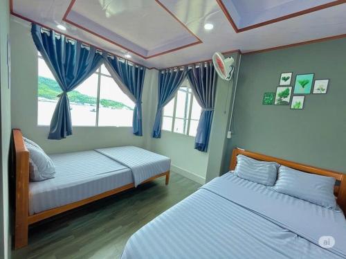Postel nebo postele na pokoji v ubytování Hoàng Anh Motel