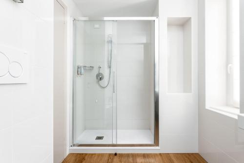 a shower with a glass door in a bathroom at Best Western Hotel Nazionale in Sanremo