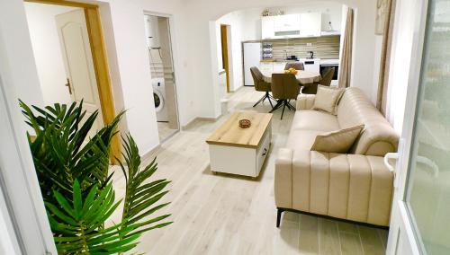 a living room with a couch and a table at Sweet Hilltop Escape in Zelenika