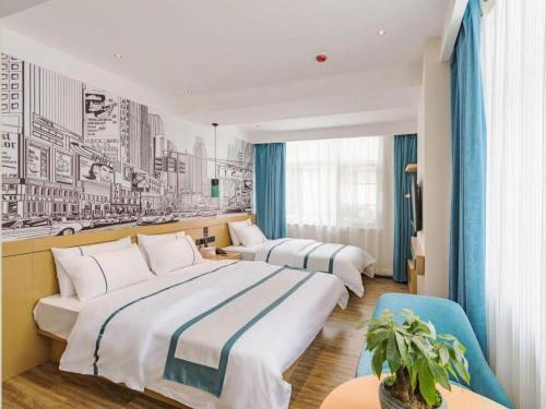 two beds in a hotel room with blue curtains at City Comfort Inn Lhasa Potala Palace Scenic View in Lhasa