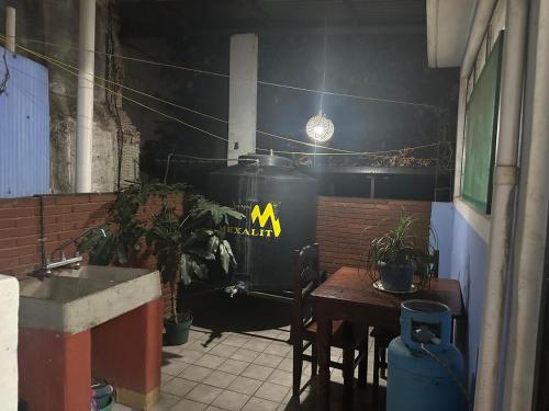 a restaurant with a table and a train in a room at Departamento en el centro de Oaxaca in Oaxaca City