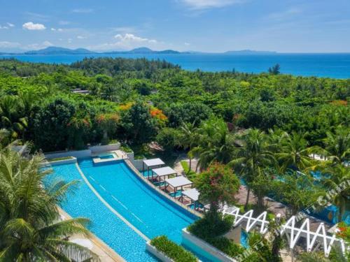 an aerial view of a resort with a swimming pool at The Mangrovetree Sanya Resort in Sanya